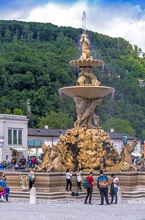 95166650-salzburg-austria-july-15-2017-huge-fountain-on-rezidenzplatz-residence-square-sculptor-tomasso-di-ga.jpg